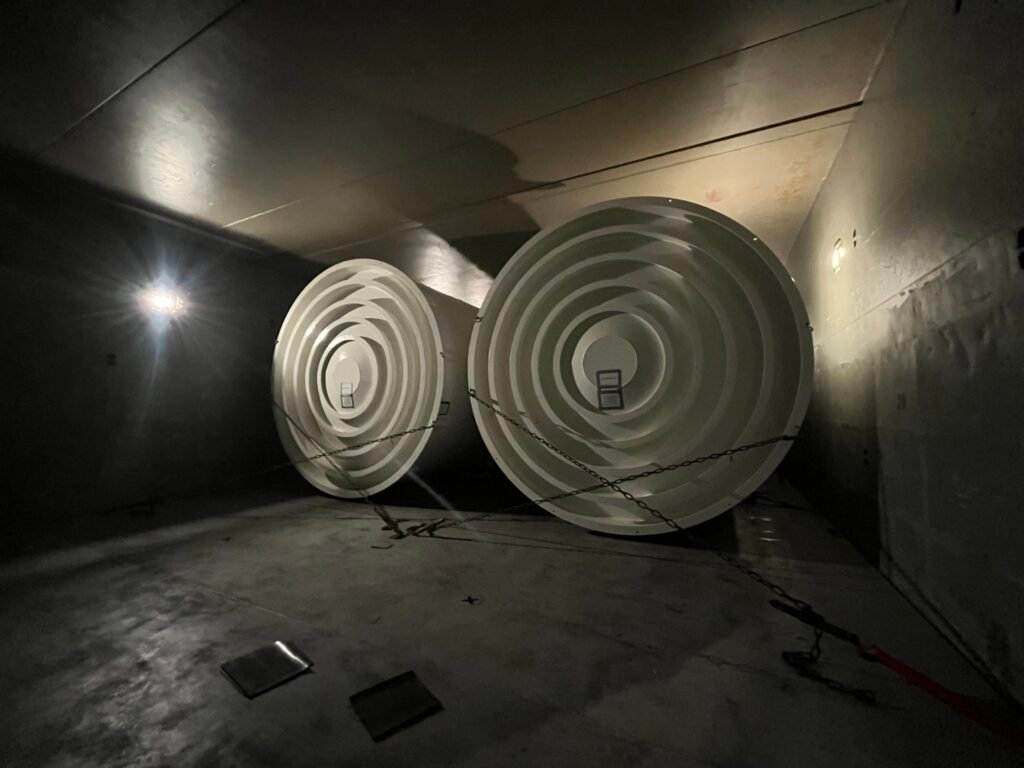 large steel tanks secured with chains under ship's deck before voyage to Norway