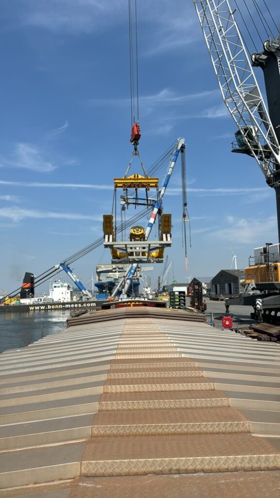 heavy LARS being loaded into barge for transfer to terminal