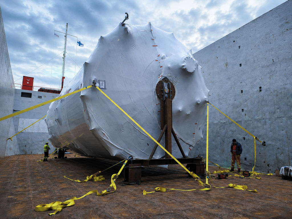 large steel tank loaded, lashed and secured for transport on chartered ship from Finland to Sweden