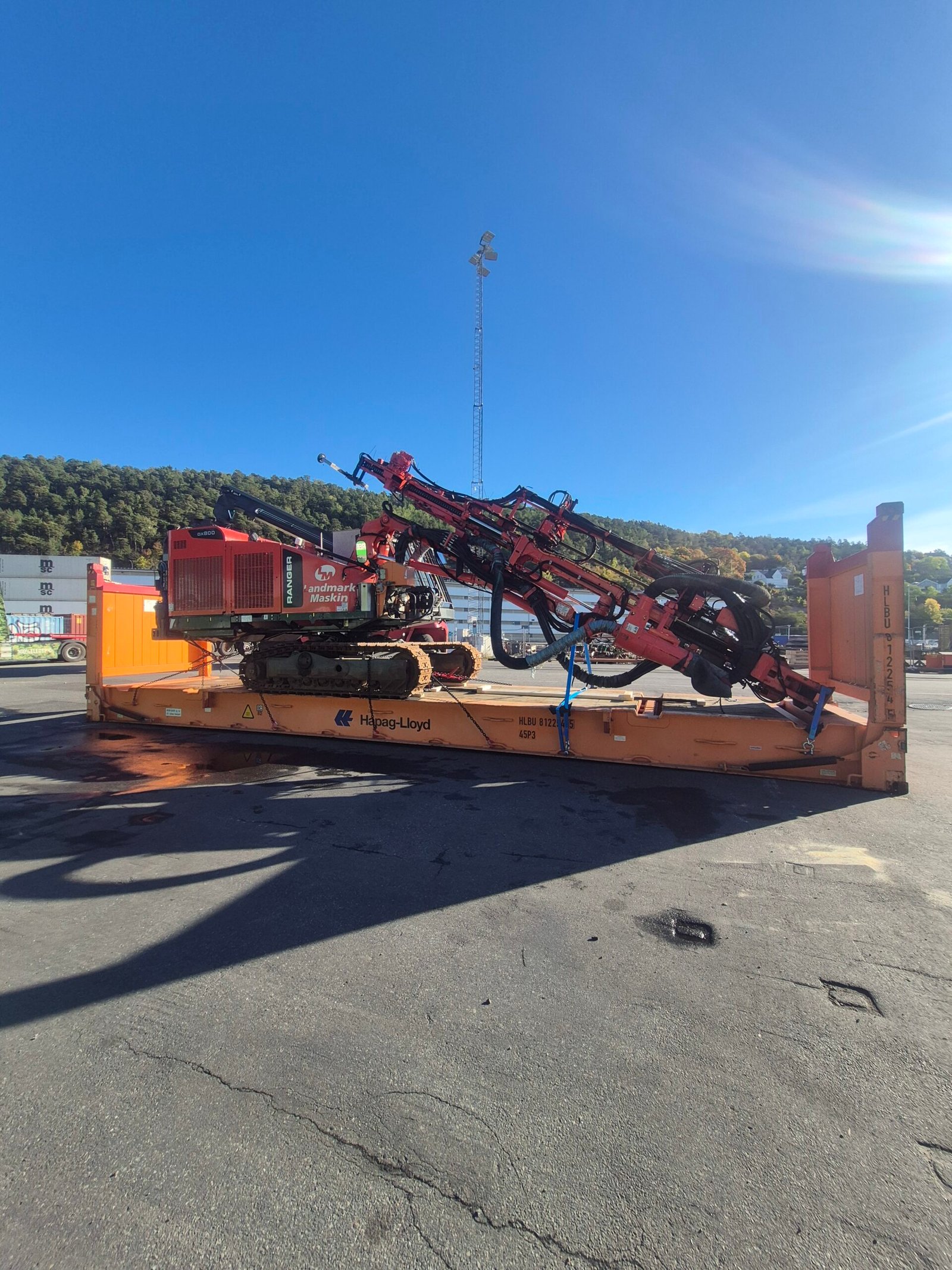 Sandvik DX800 drilling rig secured on a Hapag-Lloyd flat-rack in Oslo for shipment from Norway to Luanda