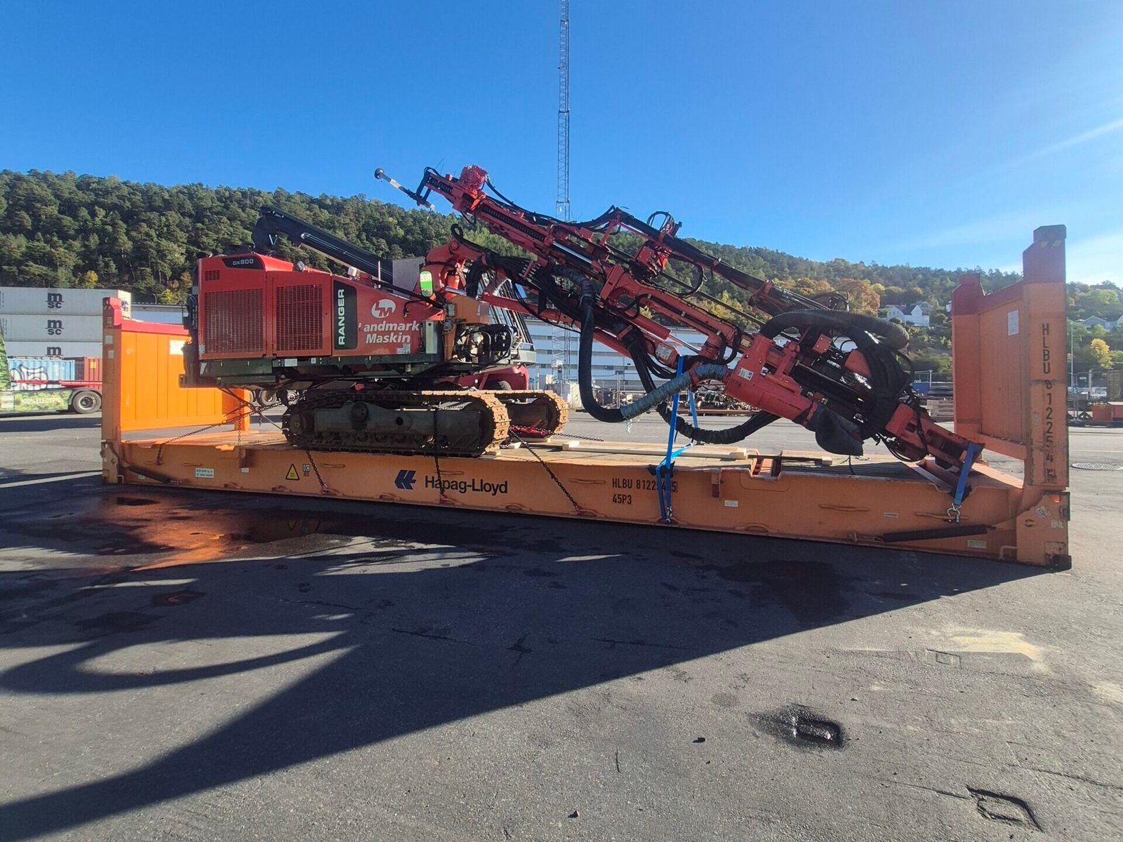 Sandvik DX800 drilling rig secured on a Hapag-Lloyd flat-rack in Oslo for shipment to Luanda
