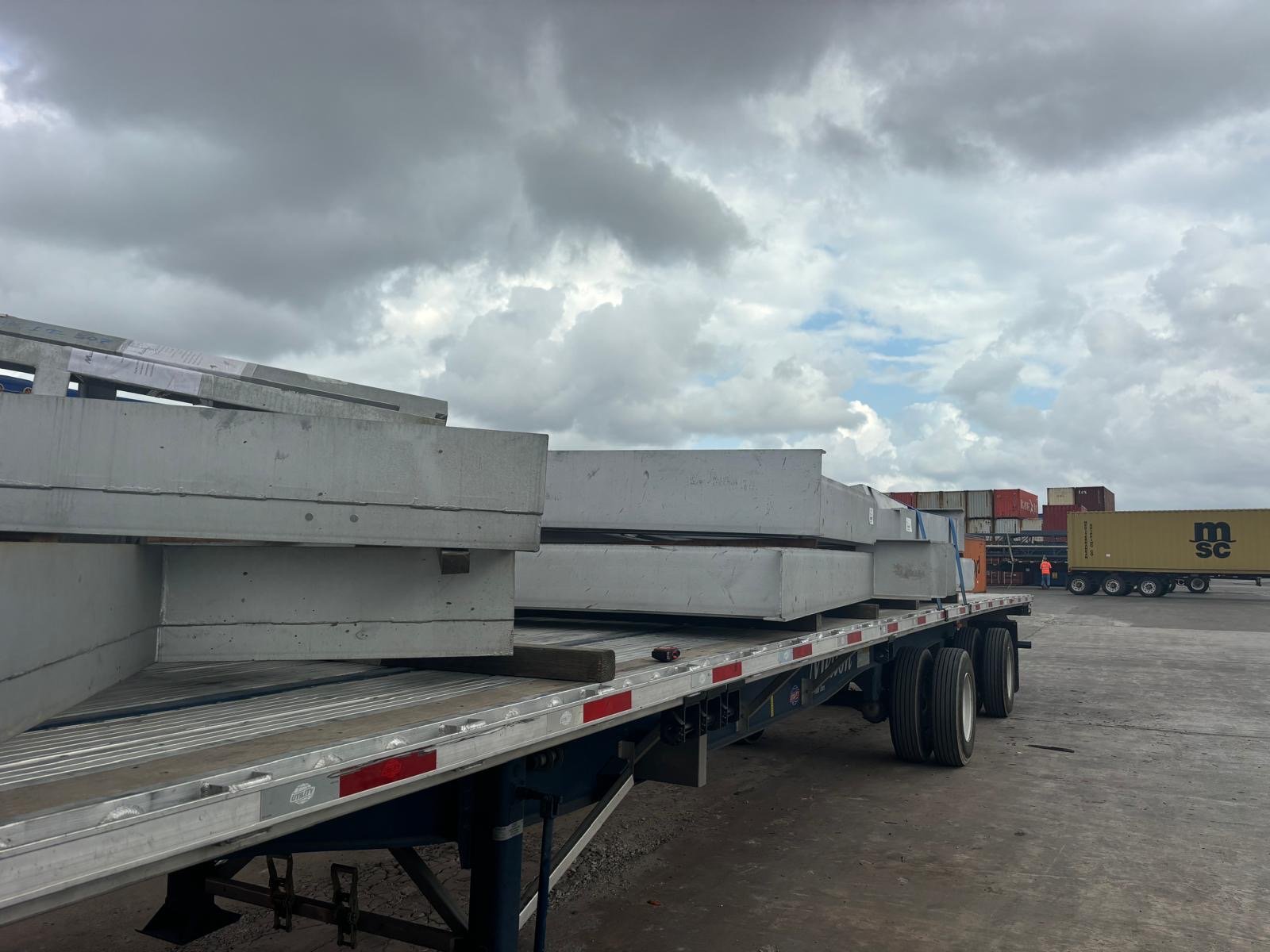 Oversized furnace steelwork transferred from a flat-rack to a flatbed trailer for US inland delivery